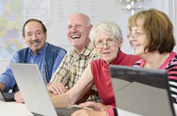 image of senior adults with laptops